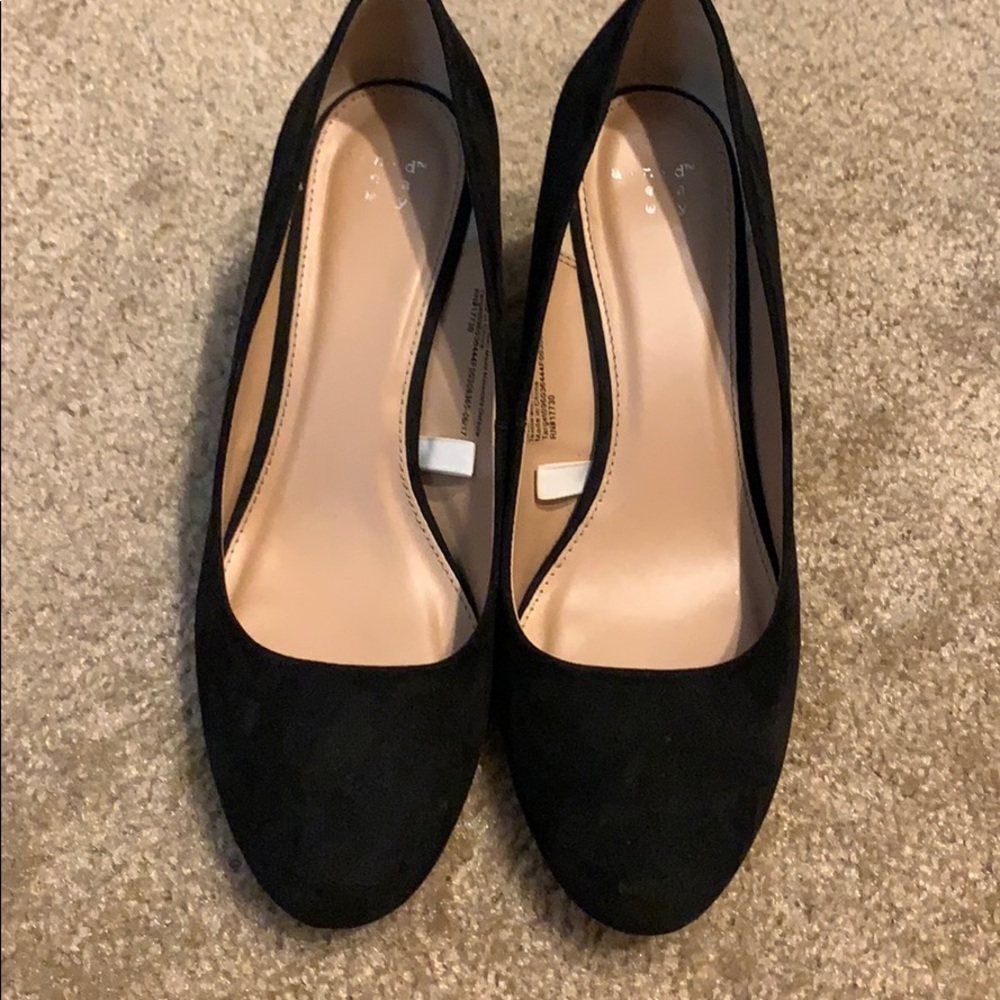 Black closed toe wedge.